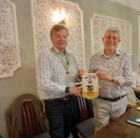 Our President Andrew Barwood presents a Watton banner to Jean-Marie Vernon